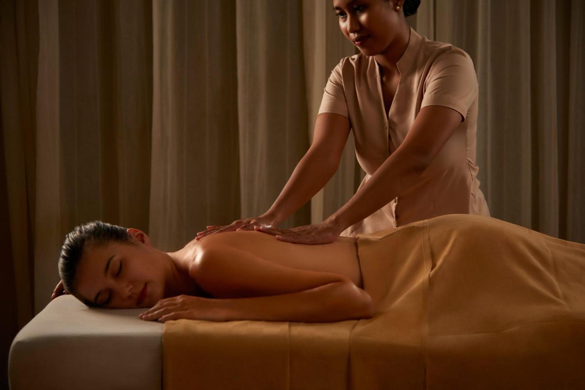 Courtyard By Marriott Bali Seminyak Resort Экстерьер фото A massage therapist working on a client